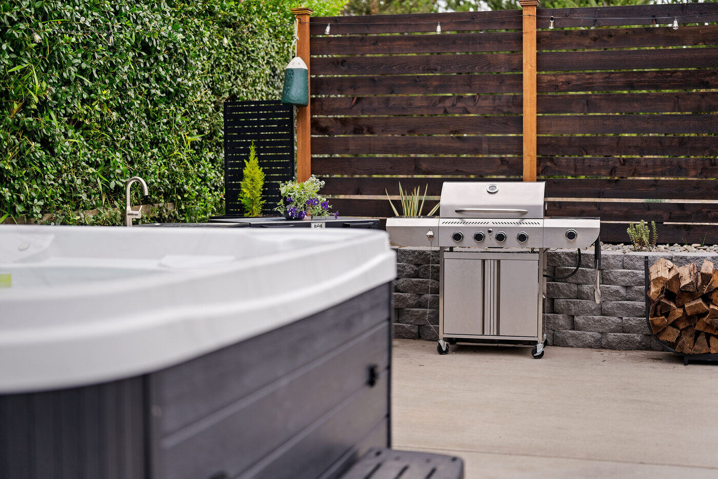 Backyard hot tub and outdoor kitchen setup